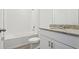 Bathroom featuring granite countertop and white cabinets at 2365 White Tail St, Davenport, FL 33837