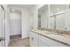 Bathroom featuring double sinks, granite countertops, and glass door shower at 2365 White Tail St, Davenport, FL 33837