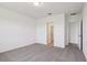 Bedroom with neutral carpet, white walls, and ensuite bathroom access at 2365 White Tail St, Davenport, FL 33837