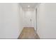 Hallway features a neutral tile floor and white doors at 2365 White Tail St, Davenport, FL 33837