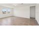 Bright and airy living room with tile flooring, creating a clean and inviting space for relaxation at 2365 White Tail St, Davenport, FL 33837