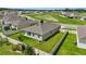 Aerial view of home showcasing fenced yard, manicured lawn, and well-maintained landscaping at 24401 Sunnys Halo Way, Sorrento, FL 32776