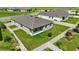 Aerial shot of a fenced backyard with green grass, a modern patio and ample space at 24401 Sunnys Halo Way, Sorrento, FL 32776