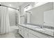 Bathroom featuring a double vanity with granite countertops and shower-tub combination at 24401 Sunnys Halo Way, Sorrento, FL 32776