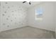 Cozy bedroom featuring whimsical polka-dot decor and a bright window at 24401 Sunnys Halo Way, Sorrento, FL 32776