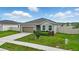 Beautiful home with well-maintained landscaping and a cozy front yard at 24401 Sunnys Halo Way, Sorrento, FL 32776