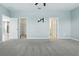 Large main bedroom leading to ensuite, closet and an open concept living area at 24401 Sunnys Halo Way, Sorrento, FL 32776