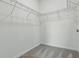 Spacious walk-in closet with wire shelving and neutral carpet at 24401 Sunnys Halo Way, Sorrento, FL 32776