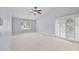 Bright bedroom with plantation shutters and sliding glass doors leading to the outdoors at 2592 Westminster Ter, Oviedo, FL 32765