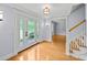 Inviting foyer features hardwood floors, natural light, and a view of the staircase at 2592 Westminster Ter, Oviedo, FL 32765