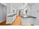 Modern kitchen featuring white cabinets, black countertops and stainless steel appliances at 2592 Westminster Ter, Oviedo, FL 32765