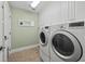 Convenient laundry room featuring a modern washer and dryer, offering ease for everyday chores at 2592 Westminster Ter, Oviedo, FL 32765