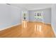 Inviting living room featuring hardwood floors and bay windows for ample natural light at 2592 Westminster Ter, Oviedo, FL 32765