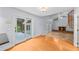 Bright living room with fireplace, spiral staircase, and access to an outdoor patio at 2592 Westminster Ter, Oviedo, FL 32765