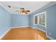 Light-filled room features a bay window and fan, offering comfort and natural light at 2592 Westminster Ter, Oviedo, FL 32765