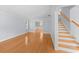 Spacious living room with hardwood floors and staircase leading to upper level at 2592 Westminster Ter, Oviedo, FL 32765