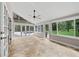 Bright sunroom with tile floors and views of the pool and backyard at 2592 Westminster Ter, Oviedo, FL 32765
