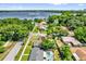 Aerial view of residential neighborhood near Clear Lake with mature trees and lush greenery at 2601 Telstar Ave, Orlando, FL 32805
