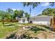 Large backyard with a fire pit and partial fencing at 2601 Telstar Ave, Orlando, FL 32805