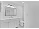Stylish bathroom with modern vanity, large mirror, tiled floors, and recessed lighting at 2601 Telstar Ave, Orlando, FL 32805
