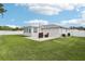Spacious backyard with a concrete patio perfect for entertaining or relaxing at 2926 Carriage Dr, South Daytona, FL 32119