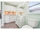 Bathroom with a new white vanity, under-cabinet lighting, and modern fixtures at 2926 Carriage Dr, South Daytona, FL 32119