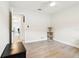 Bedroom with neutral decor and a view into the connecting living area at 2926 Carriage Dr, South Daytona, FL 32119