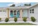 Inviting front porch with comfortable seating, stylish décor, and well-manicured landscaping at 2926 Carriage Dr, South Daytona, FL 32119