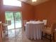 Dining area featuring tile floors, a large window view of the pool, and a modern table set at 3013 Barrymore Ct, Orlando, FL 32835