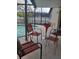 Cozy screened-in patio featuring a seating area adjacent to the swimming pool at 3013 Barrymore Ct, Orlando, FL 32835