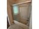 Bathroom showcasing tiled shower and tub with glass doors at 3807 Plantation Blvd, Leesburg, FL 34748