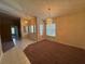 Inviting foyer featuring tile flooring, chandelier lighting, and front door view at 3807 Plantation Blvd, Leesburg, FL 34748