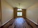 Spacious living room with vaulted ceilings, ceiling fan and wood-look flooring at 3807 Plantation Blvd, Leesburg, FL 34748