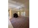 Bright living room with carpet, fan, and sliding glass doors at 3807 Plantation Blvd, Leesburg, FL 34748