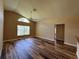 Bright living room with vaulted ceilings and wood-look flooring at 3807 Plantation Blvd, Leesburg, FL 34748