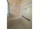 Shower with a built-in seat and grab bar at 3807 Plantation Blvd, Leesburg, FL 34748