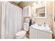 Bathroom featuring a white toilet, shower with curtain, and vanity at 4106 Alverado St, Orlando, FL 32812
