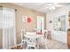 Charming dining area with a white table set, bright natural light, and a cozy atmosphere at 4106 Alverado St, Orlando, FL 32812