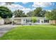 Charming single-story home with well-manicured lawn, covered parking and front seating area at 4106 Alverado St, Orlando, FL 32812