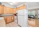 Bright kitchen featuring ample cabinets, appliances, and convenient access to the living area at 4106 Alverado St, Orlando, FL 32812