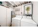 Laundry room with washer, dryer, cabinet, and water heater at 4106 Alverado St, Orlando, FL 32812