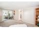 Bright living room with neutral colors, large sliding glass doors, and bookshelf at 4106 Alverado St, Orlando, FL 32812