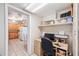 Office area with desk and shelves, adjacent to the kitchen at 4106 Alverado St, Orlando, FL 32812