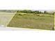 Lakefront property with lush green landscape, outlined in yellow at 4343 Juliana Lake Dr, Auburndale, FL 33823