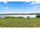 Beautiful lake view with mature trees and blue sky creating a serene and picturesque backdrop at 4343 Juliana Lake Dr, Auburndale, FL 33823
