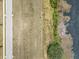 Aerial view of a land next to water and a road, showing off potential home site at 4343 Juliana Lake Dr, Auburndale, FL 33823