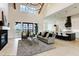 Bright open living room with kitchen island, fireplace, black-framed windows, and lots of natural light at 4343 Juliana Lake Dr, Auburndale, FL 33823