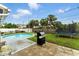 Backyard with a clean pool, trampoline, and patio area, perfect for entertaining at 4629 Spottswood Dr, Orlando, FL 32812
