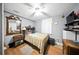 Bedroom with hardwood floors, ceiling fan, and window providing natural light at 4629 Spottswood Dr, Orlando, FL 32812