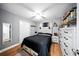 Well-lit bedroom featuring wood-look floors, a closet, a ceiling fan, and rustic furniture at 4629 Spottswood Dr, Orlando, FL 32812